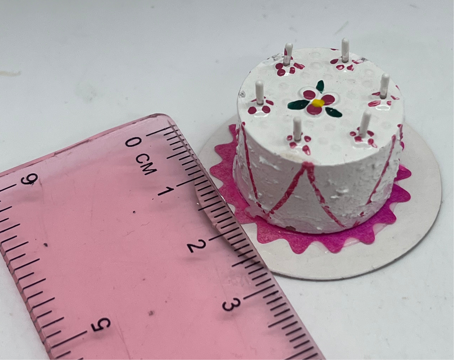 Dolls house birthday cake with candles