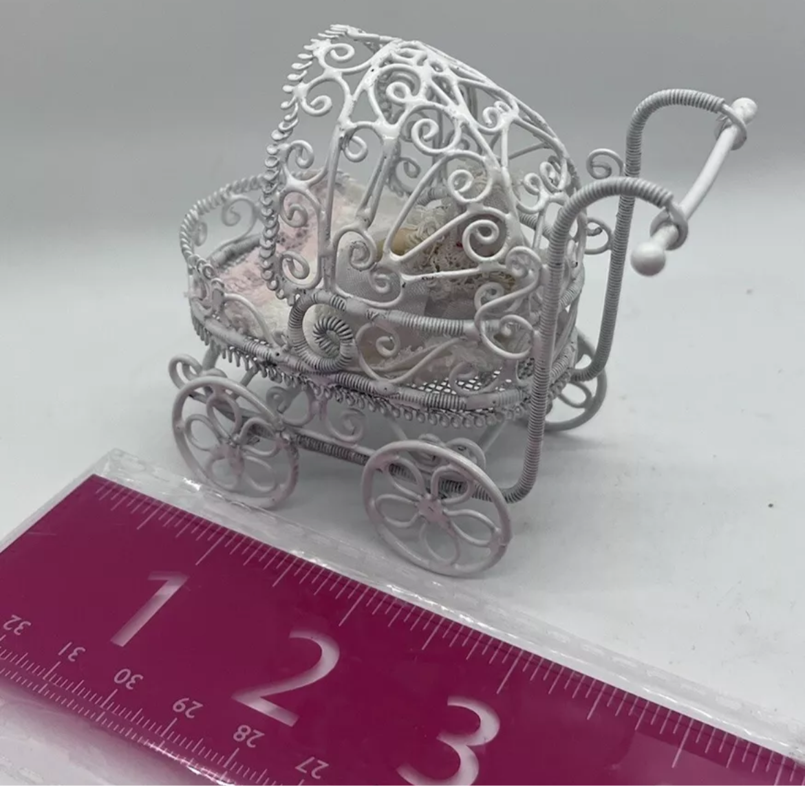Dolls house metal white wire pram and baby.