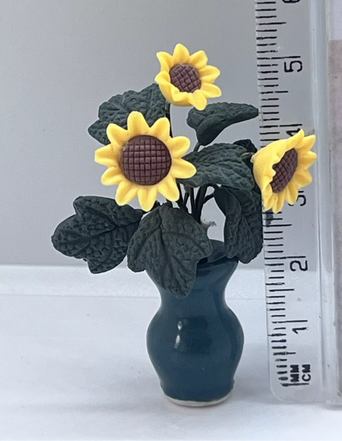 Dolls house sunflowers in vase