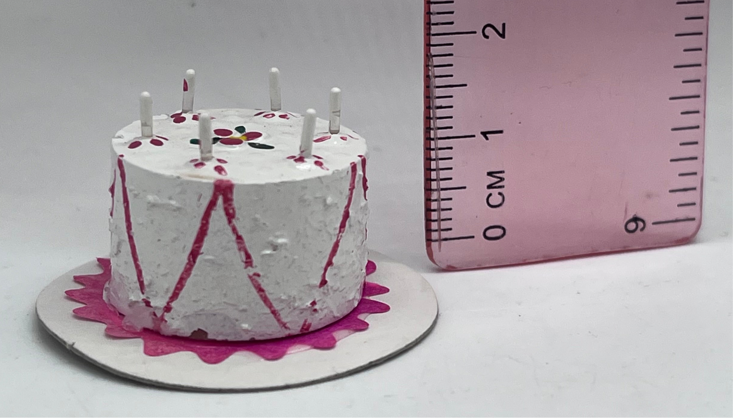 Dolls house birthday cake with candles
