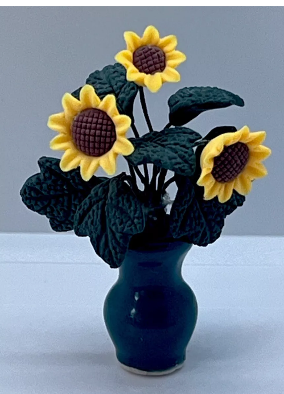 Dolls house sunflowers in vase
