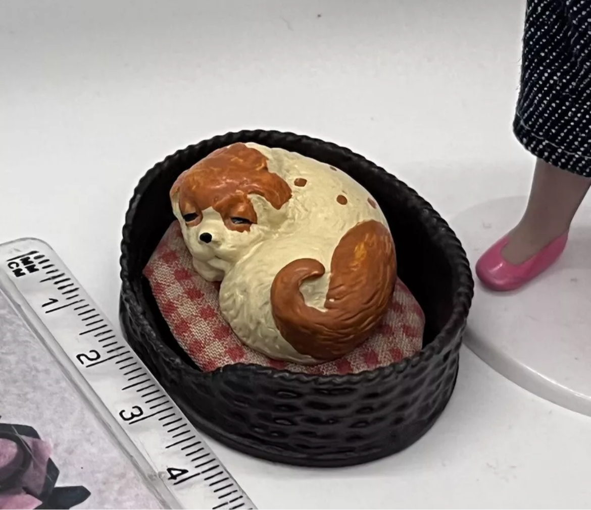 Dolls house sleeping dog in basket