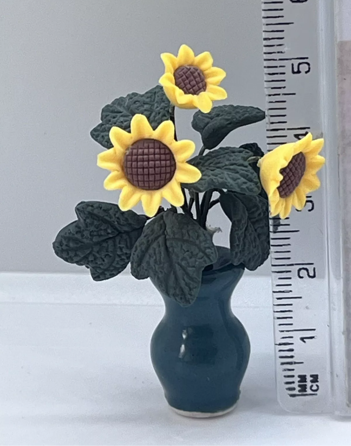Dolls house sunflowers in vase