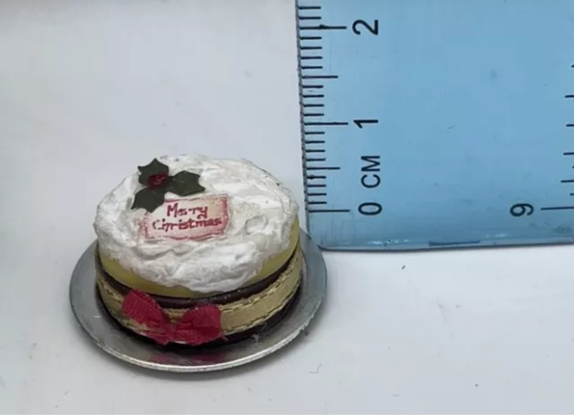 Dolls house Christmas cake on metal plate