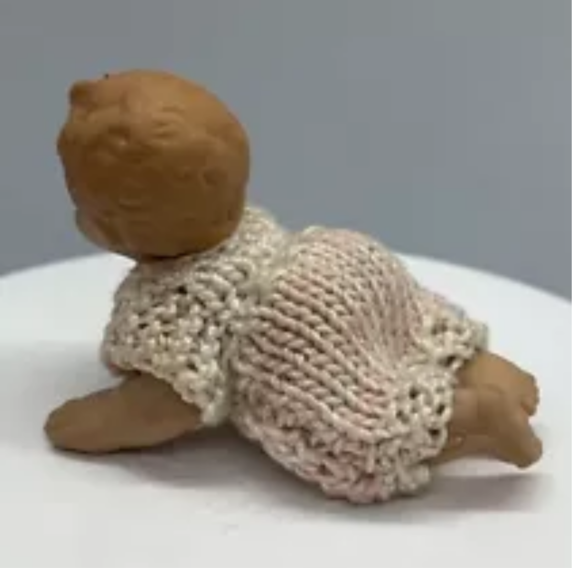 Dolls house baby with hand knitted romper