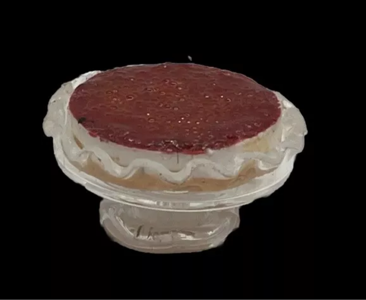 Dolls house strawberry cheesecake on glass pedestal