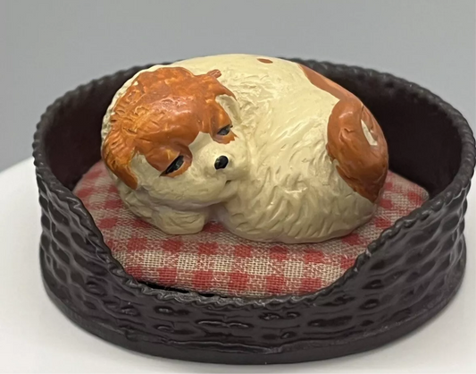 Dolls house sleeping dog in basket