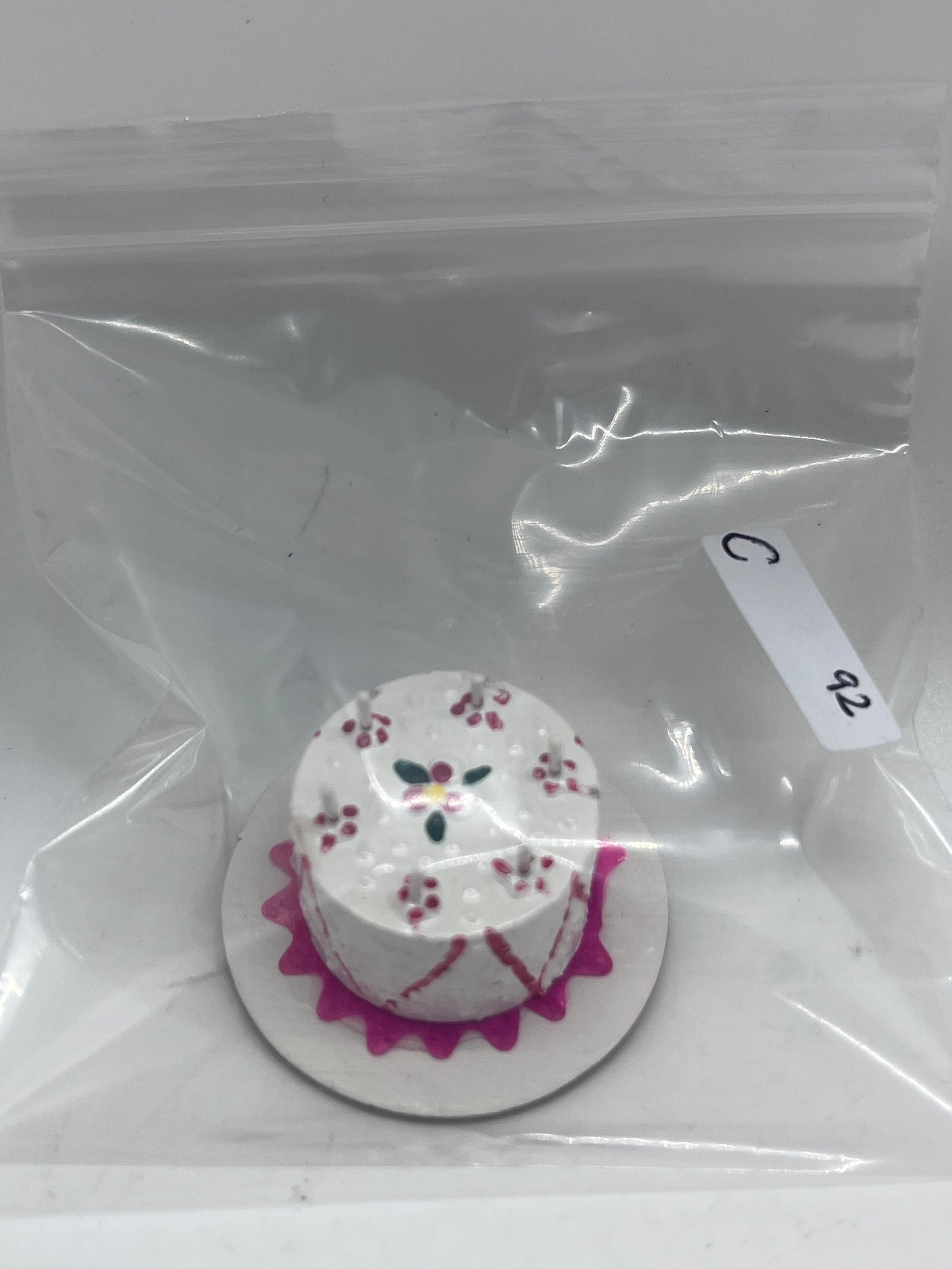 Dolls house birthday cake with candles
