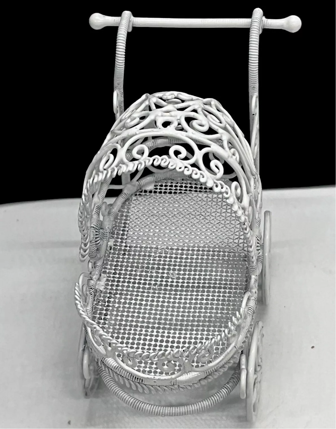 Dolls house metal white wire pram and baby.