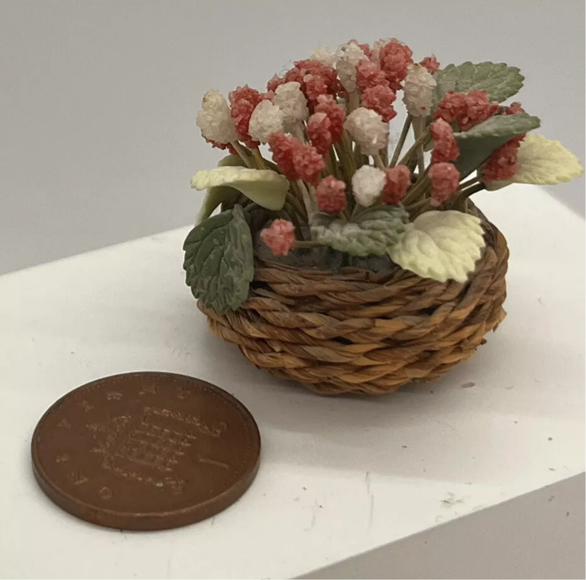 Dolls house flowers in basket