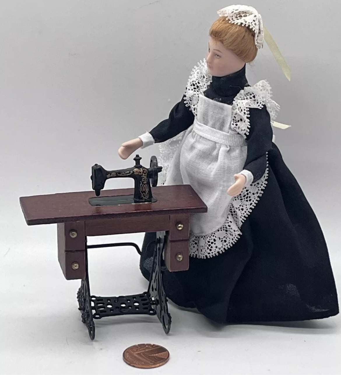 Dolls house sewing machine on table