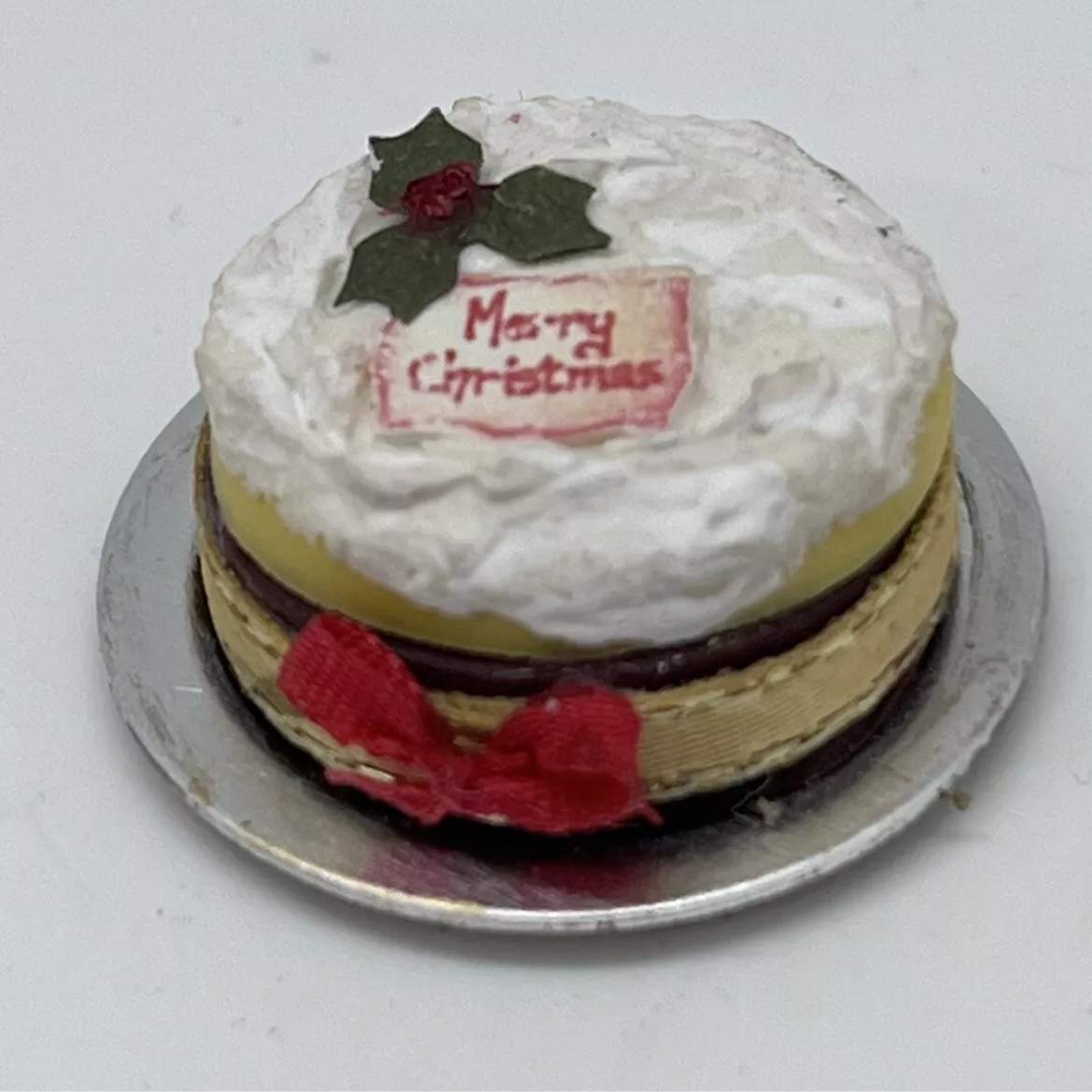 Dolls house Christmas cake on metal plate