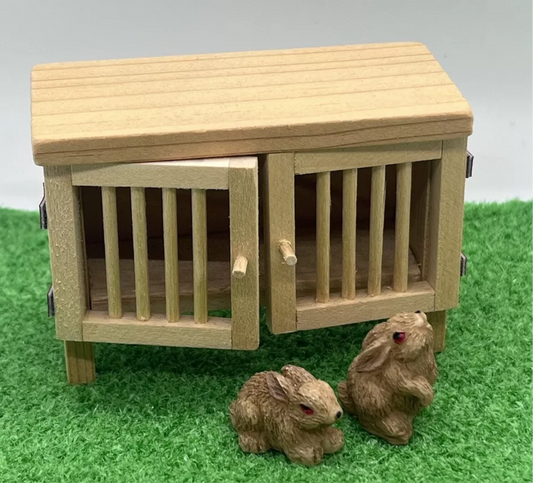 Dolls house hutch and 2 rabbits