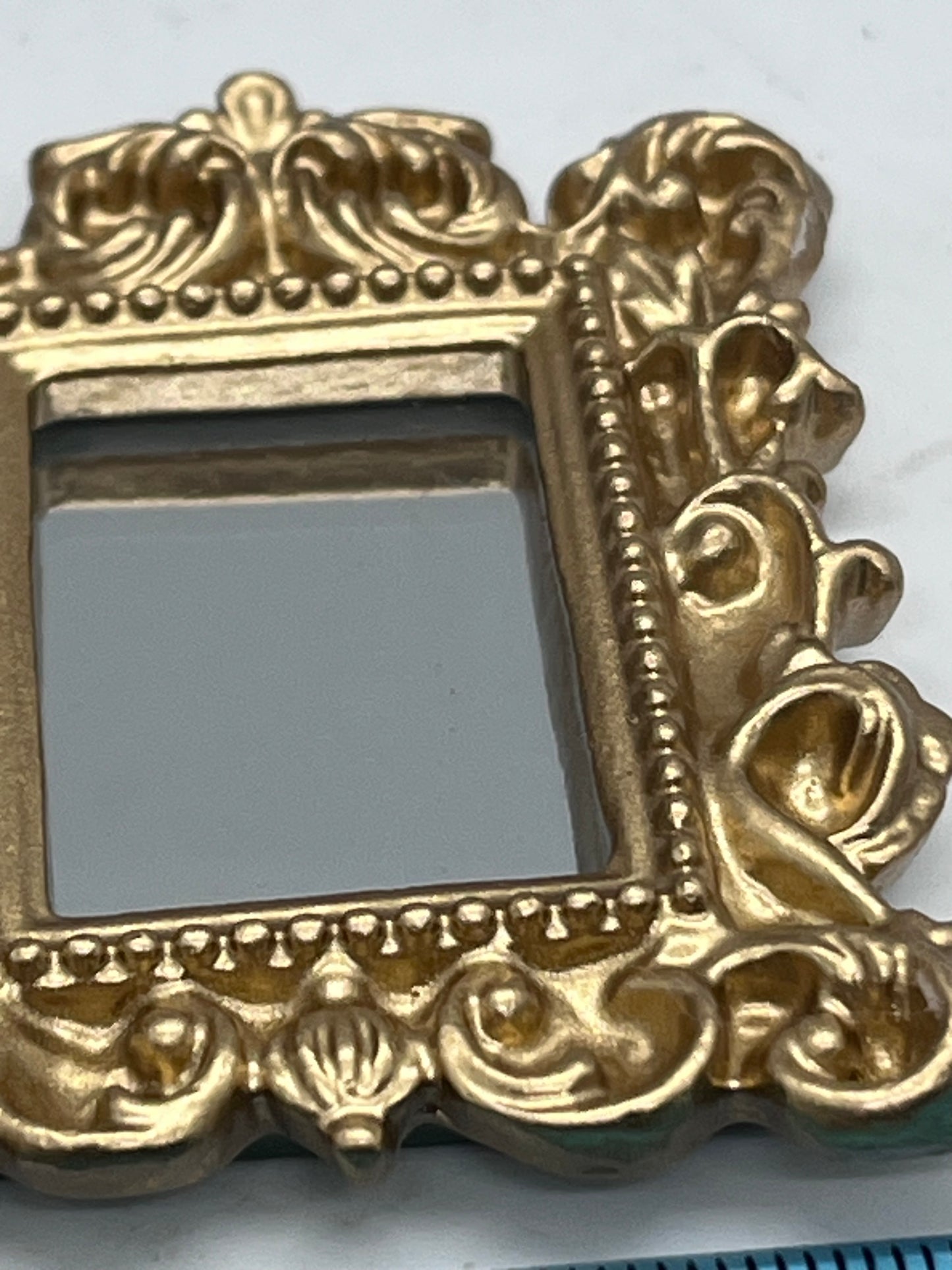 Dolls house metal framed ornate mirror