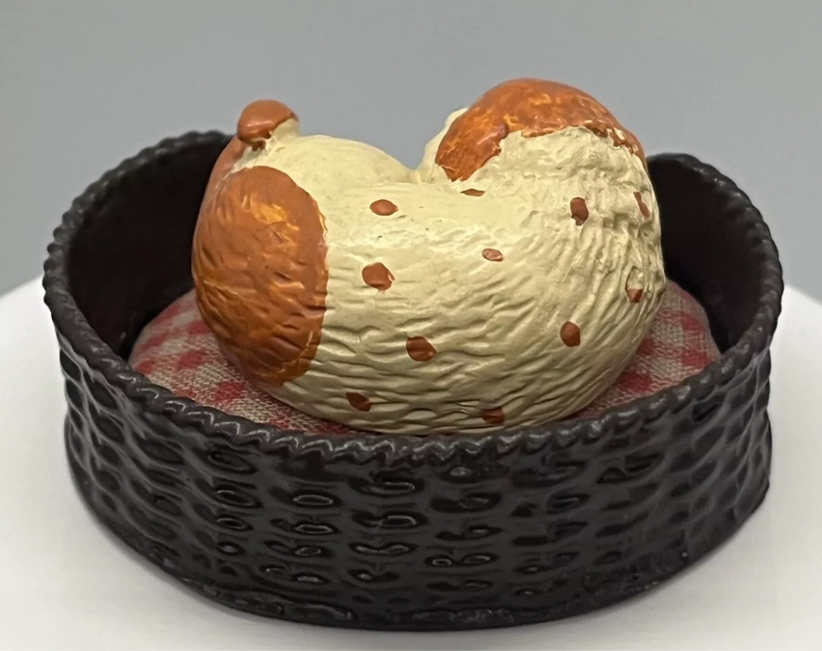 Dolls house sleeping dog in basket