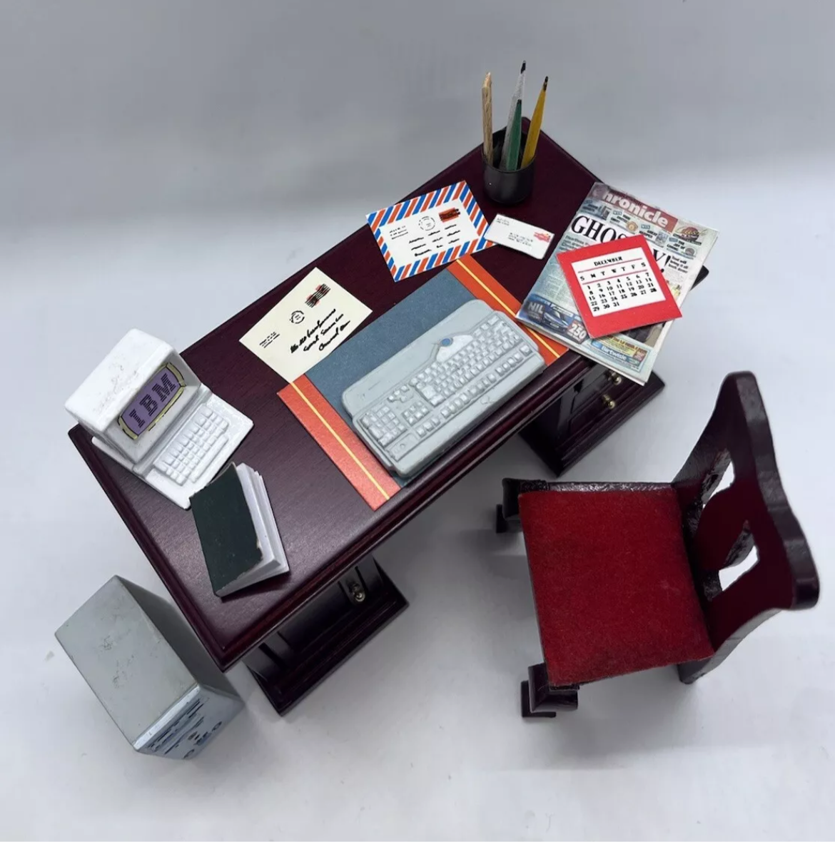 Dolls house desk, chair & all accessories.