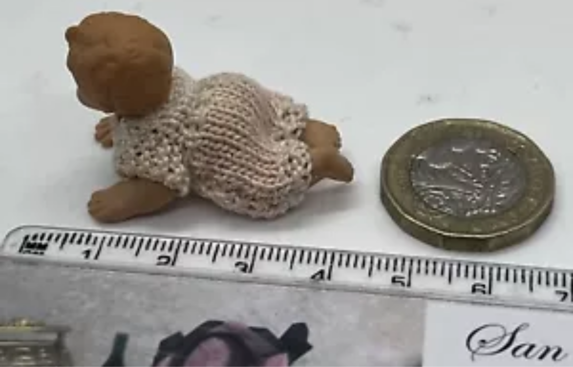 Dolls house baby with hand knitted romper