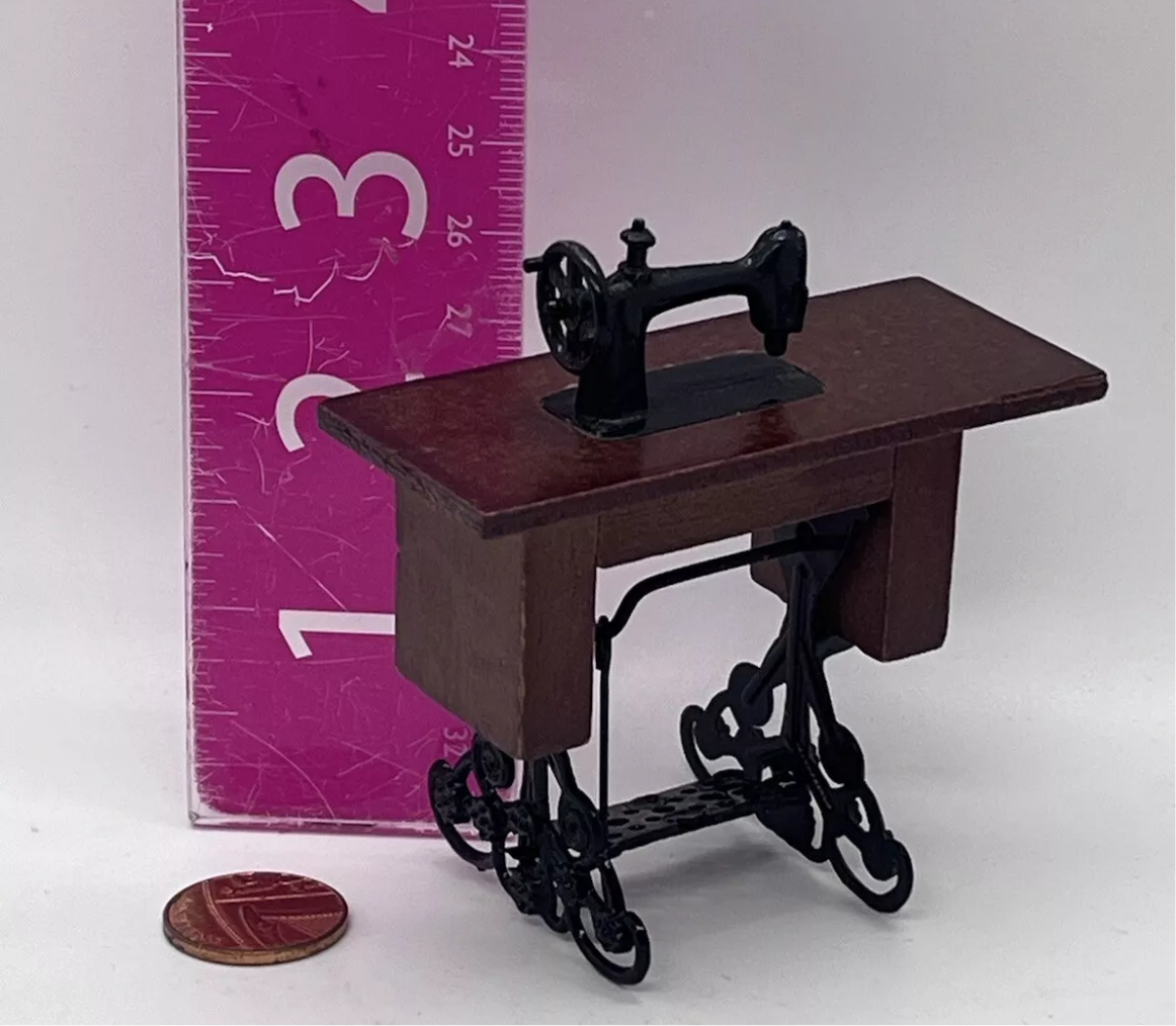 Dolls house sewing machine on table