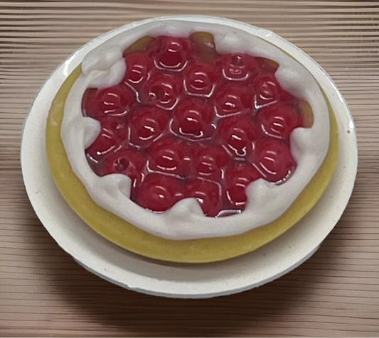 Dolls house cherry tart on a plate