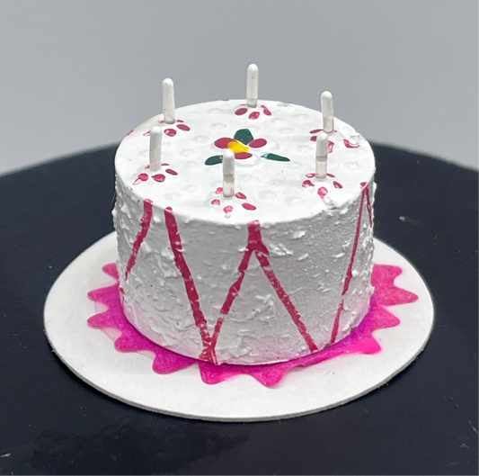 Dolls house birthday cake with candles
