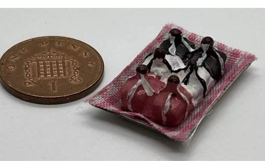 Dolls house French fancies on metal tray