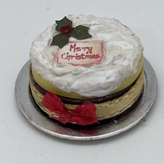 Dolls house Christmas cake on metal plate